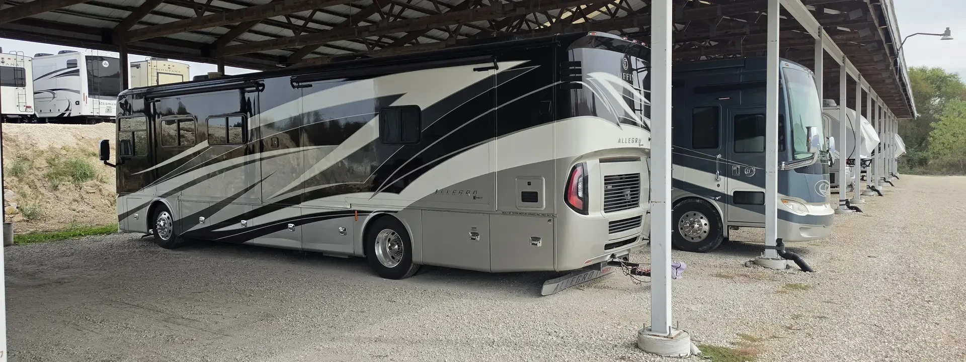 Large motorhome parked under Big River's covered RV storage structure