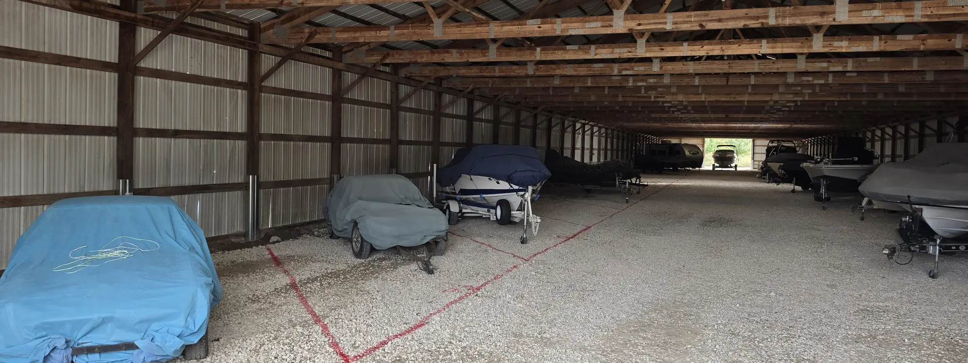 Boats and vehicles under cover in Big River's enclosed storage building
